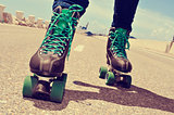 closeup of a young man roller skating, with a cross-processed ef