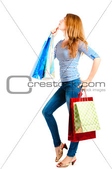 woman posing on a white background with packages