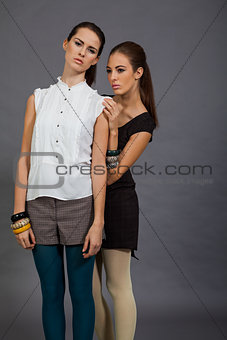 two beutiful brunette girls in casual fashion and accessory 