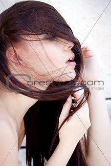 beautiful woman portrait wirth long straight dark brown hair 