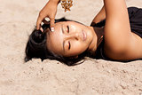 beautiful asian woman with colorful makeup on the beach 