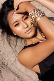 beautiful asian woman with colorful makeup on the beach 