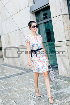 attractive woman with sunglasses in the city summertime
