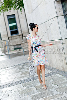 attractive woman with sunglasses in the city summertime