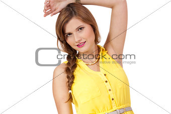 smiling young brunette woman in yellow dress isolated