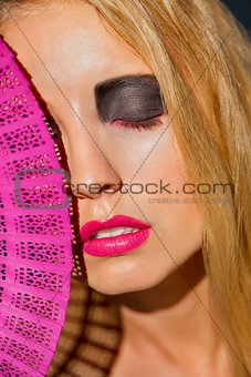 young beautiful woman with smokey eyes and pink lips