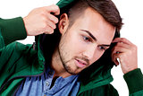 young adult man with green jacket portrait isolated