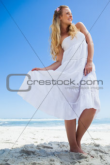 Pretty carefree blonde posing on the beach