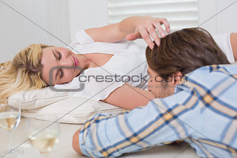 Cute young couple lying on floor together