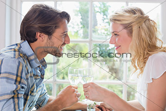 Cute smiling couple having a meal together