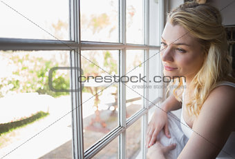 Pretty blonde looking out the window