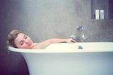 Serene blonde lying in the bath