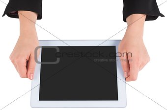 Businesswomans hands holding tablet