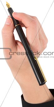 Businesswomans hand writing with fountain pen