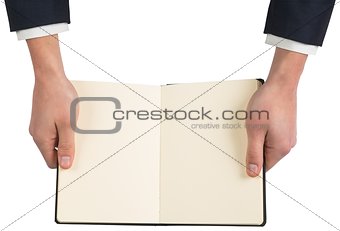 Hands holding open book