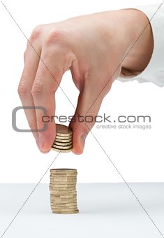 Businessman counting his coins at desk