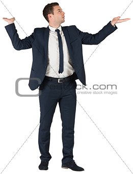 Businessman standing with arms out