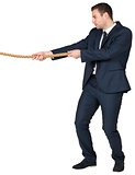 Young businessman pulling a rope