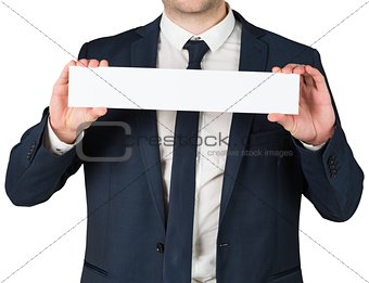 Businessman showing card to camera