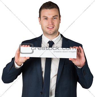 Happy businessman showing card to camera