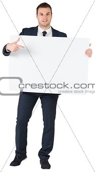 Young businessman showing card to camera
