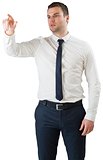 Young serious businessman pointing
