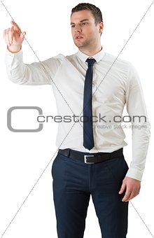 Young serious businessman pointing