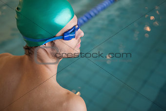 Fit swimmer by the swimming pool