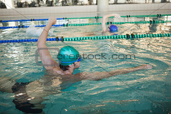 Man and woman racing in the swimming pool