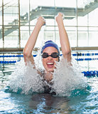 Excited swimmer cheering in the swimming pool