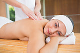 Smiling woman getting a back massage
