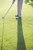 Golfer standing on the putting green