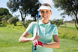 Female golfer smiling at camera