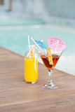 Two cocktails beside the swimming pool