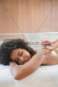 Gorgeous woman enjoying a back massage