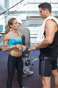 Bodybuilding man and woman talking together