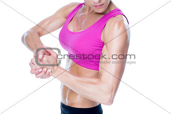 Female bodybuilder flexing mid section