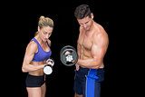 Crossfit couple posing with dumbbells
