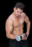 Focused crossfitter lifting up heavy dumbbell
