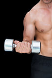 Strong crossfitter lifting up heavy dumbbell
