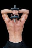 Strong crossfitter lifting up heavy black dumbbell behind head