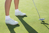 Lady golfer on the putting green