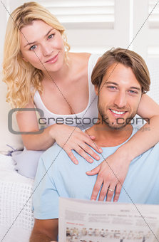 Young couple sitting on the couch together