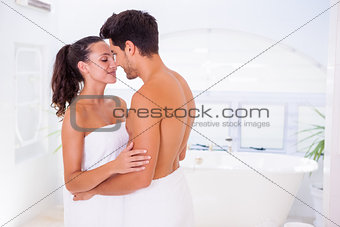 Attractive couple embracing in the morning