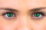 Bright green eyes on pretty female face