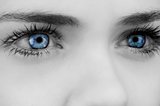 Blue eyes on grey face