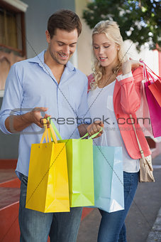 Stylish young couple on a shopping trip