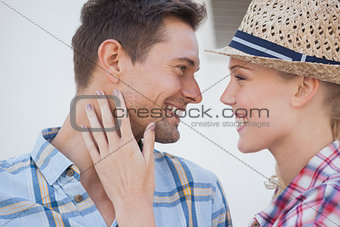 Young hip couple wearing check shirts facing each other