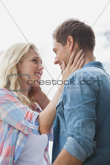 Cute young couple standing and facing each other