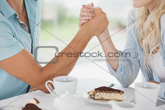 Cute couple having coffee together in cafe